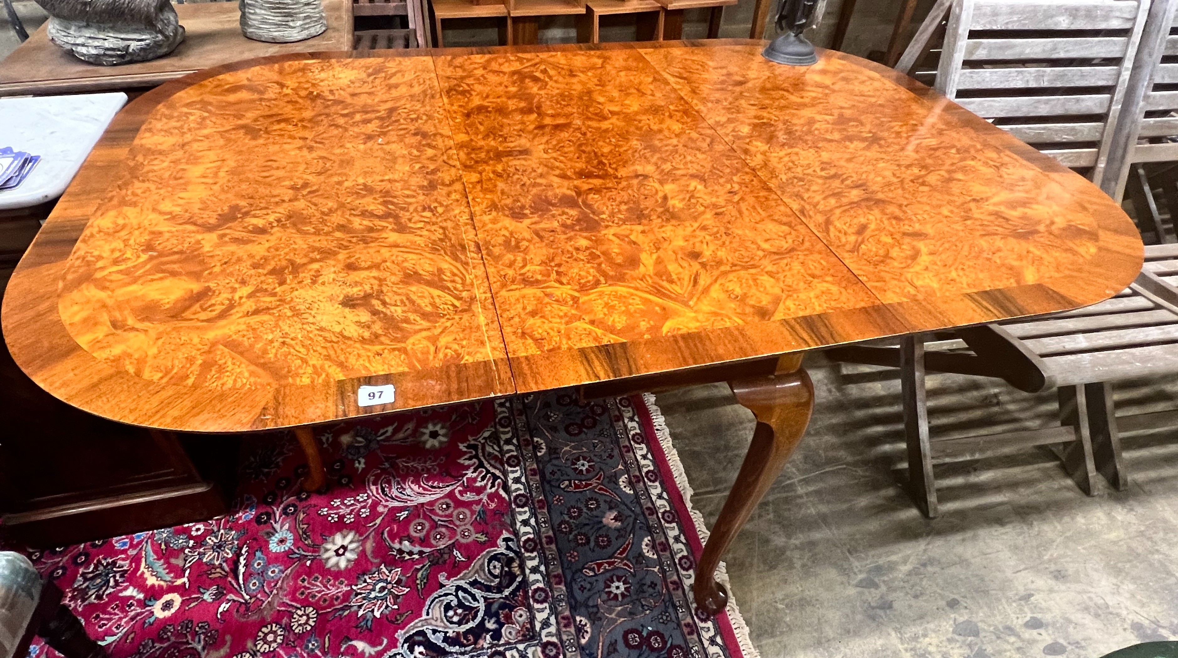 A Queen Anne Walnut revival burr walnut pad foot drop leaf dining table, extended 144cm wdith 99cm height 74cm